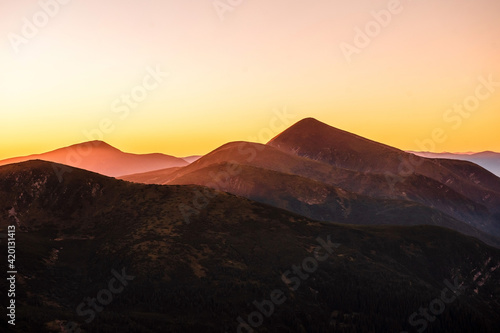 Fascinating summer sunset over green of mountains © WellStock
