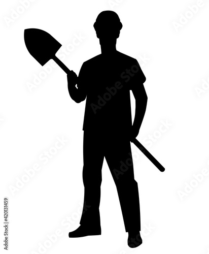 Silhouette of a worker in a helmet and vest standing with a shovel in his hands