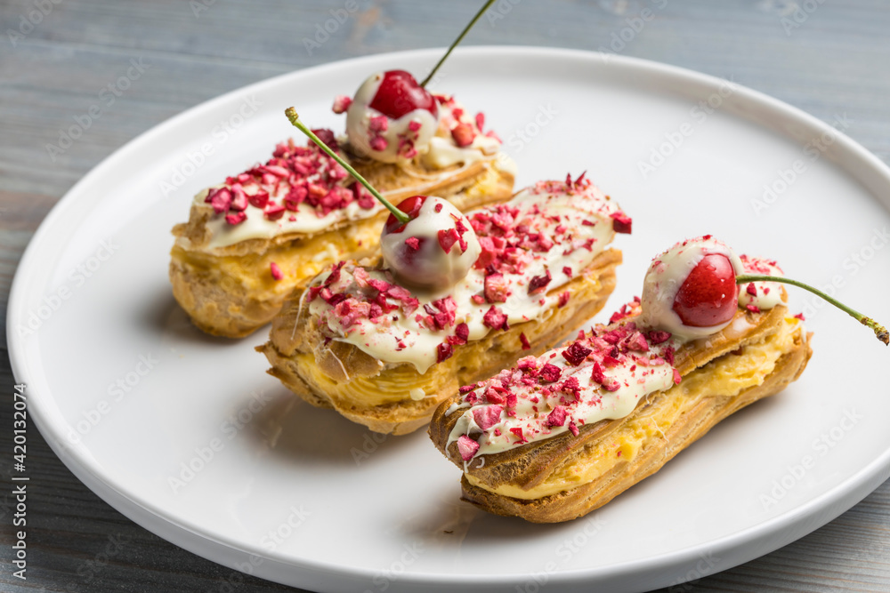 Traditional french eclairs with chocolate and Strawberry. Traditional french eclairs with chocolate and Strawberry.