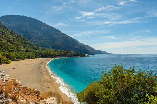Kidrak beach with turquoise water near Oludeniz town on the coast of Mugla region in Turkey on summer day