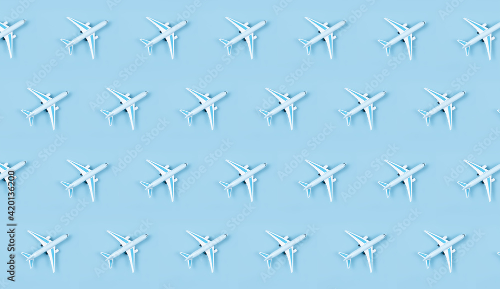 Airplane, miniature pattern on a blue background. Airplane, miniature pattern on a blue background.