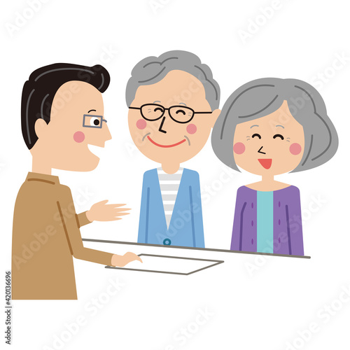 ポップな受付　眼鏡の男性係員　シニアの夫婦　パーテーション