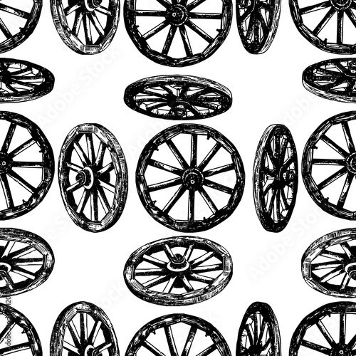 Seamless background of drawn old wooden wheels
