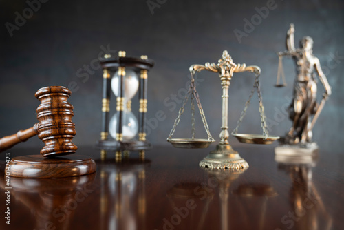 Law and justice concept. Law symbols composition: judge’s gavel, Themis statue and scale.