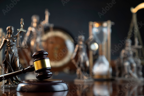 Law and justice concept. Law symbols composition: judge’s gavel, Themis statue and scale.