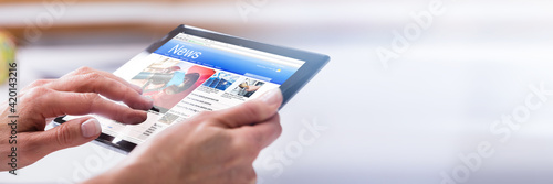 Close-up Of A Person's Hand Using Digital Tablet