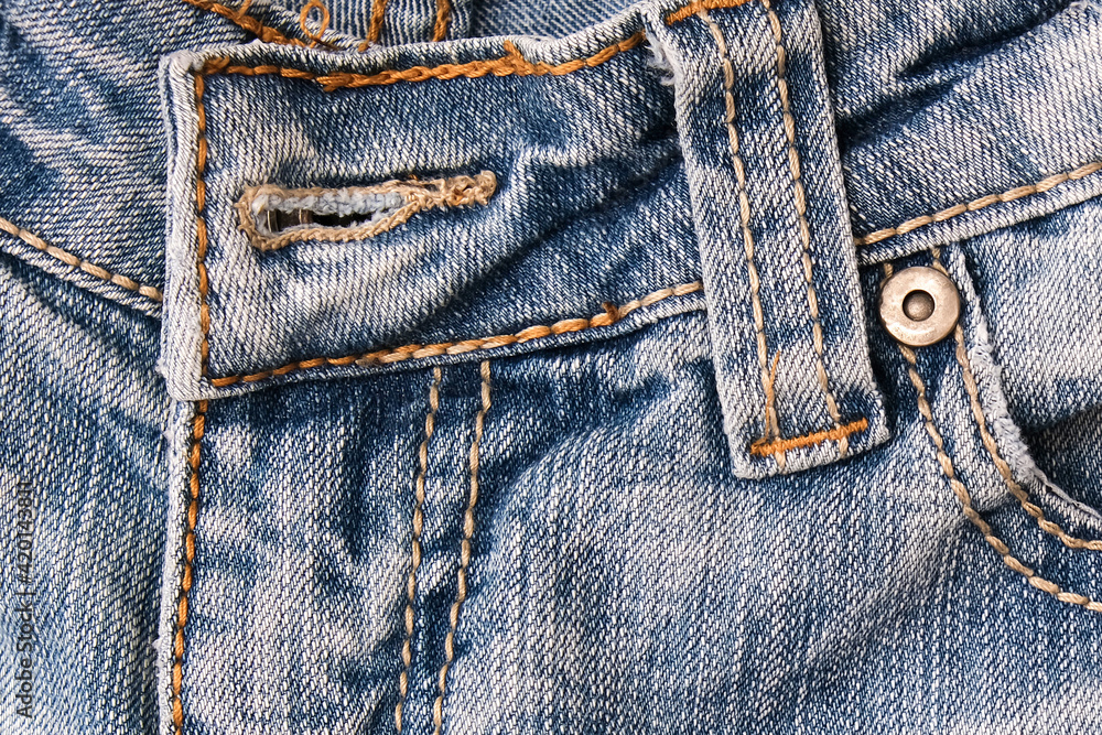 Shabby blue jeans background with fore pocket, denim fashion background Shabby blue jeans background with fore pocket, denim fashion background