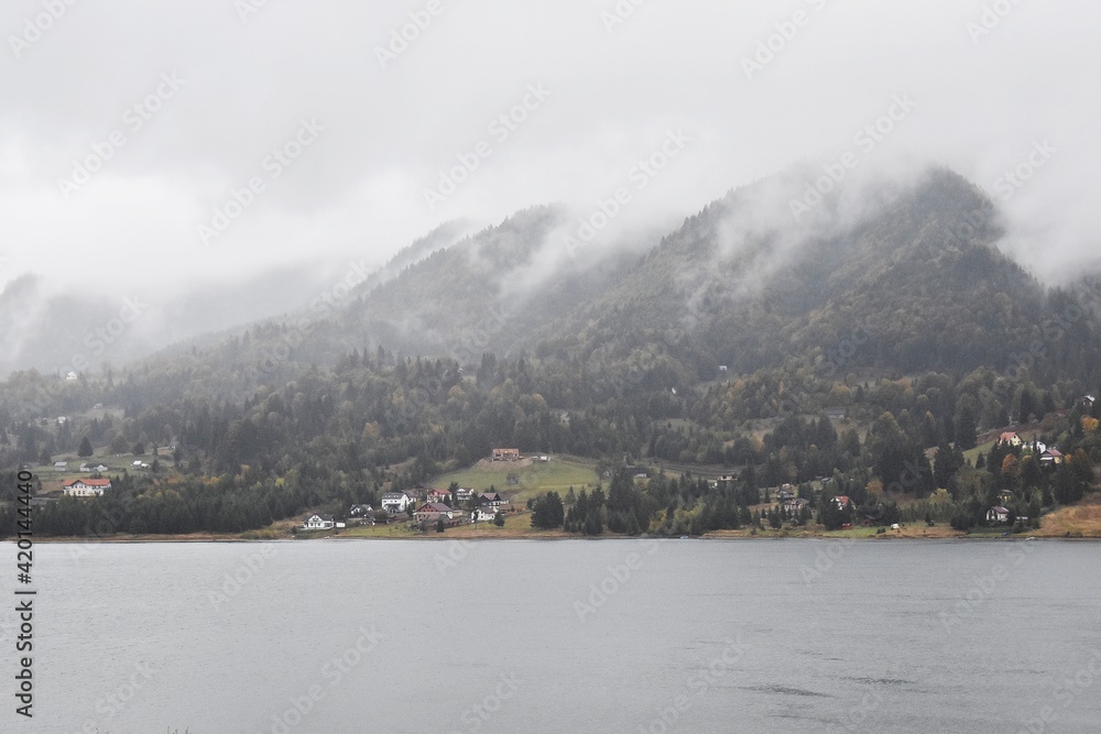 View of Colibita lake on a cloudy day, in Carpathian mountains in Romania, Transylvania, Bistrita Nasaud county.
