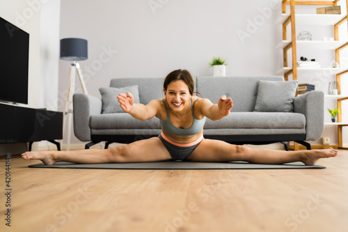 Young Woman In Split Stretching Sport Pose