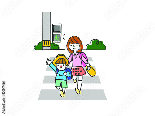 青信号で横断歩道を渡る子供たち