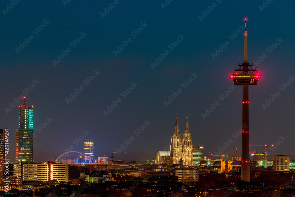 Cologne cityscape at night, Germany..View of Cologne Cathedral and Colonius TV Tower.