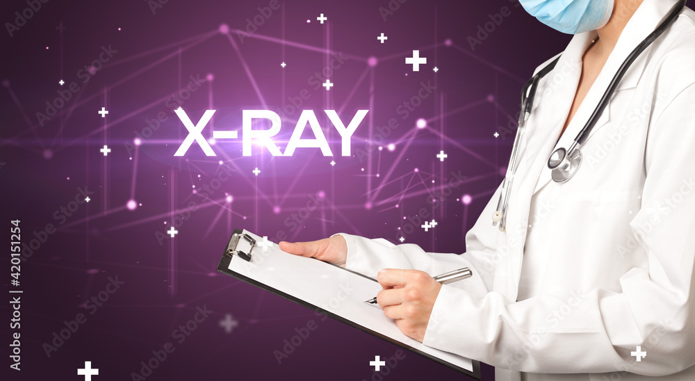 Doctor fills out medical record Doctor fills out medical record
