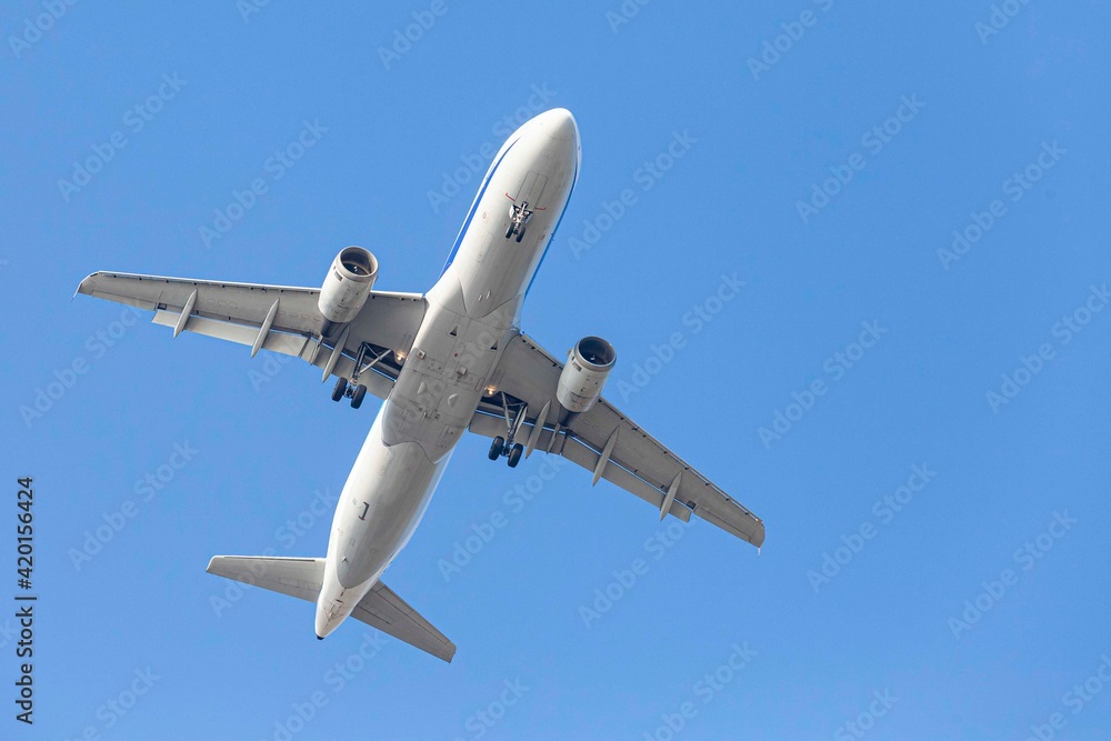 A large Boeing aircraft after take off from the airport A large Boeing aircraft after take off from the airport