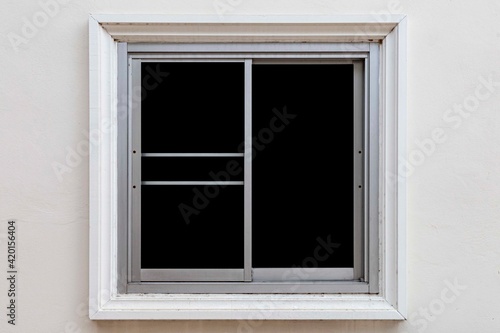 White sliding aluminum window frame and white cement wall