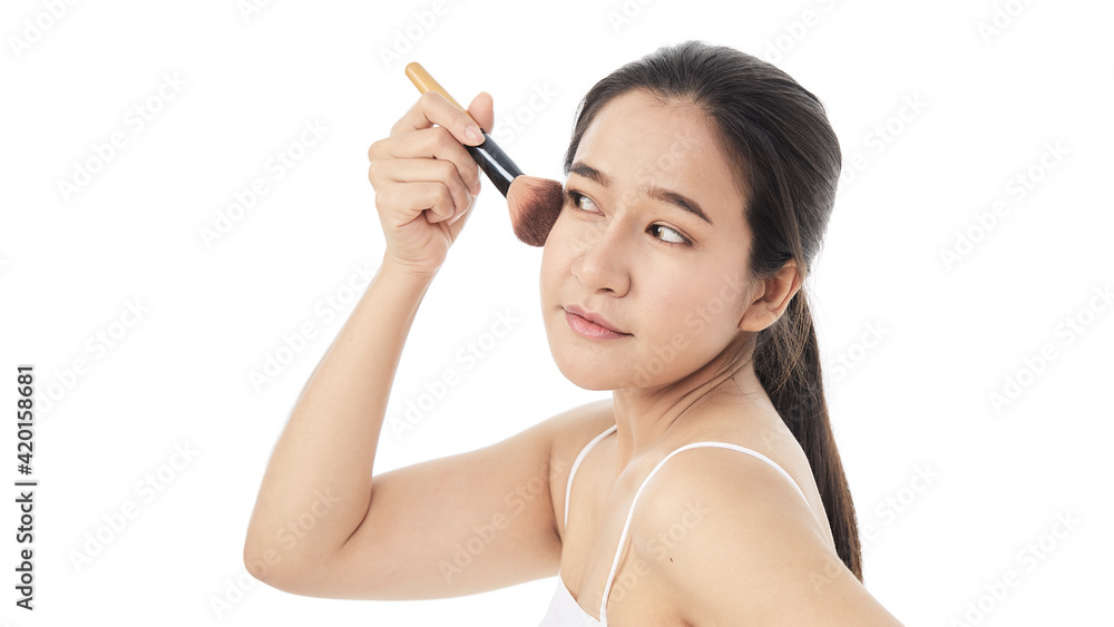 woman applying make up with a brush woman applying make up with a brush