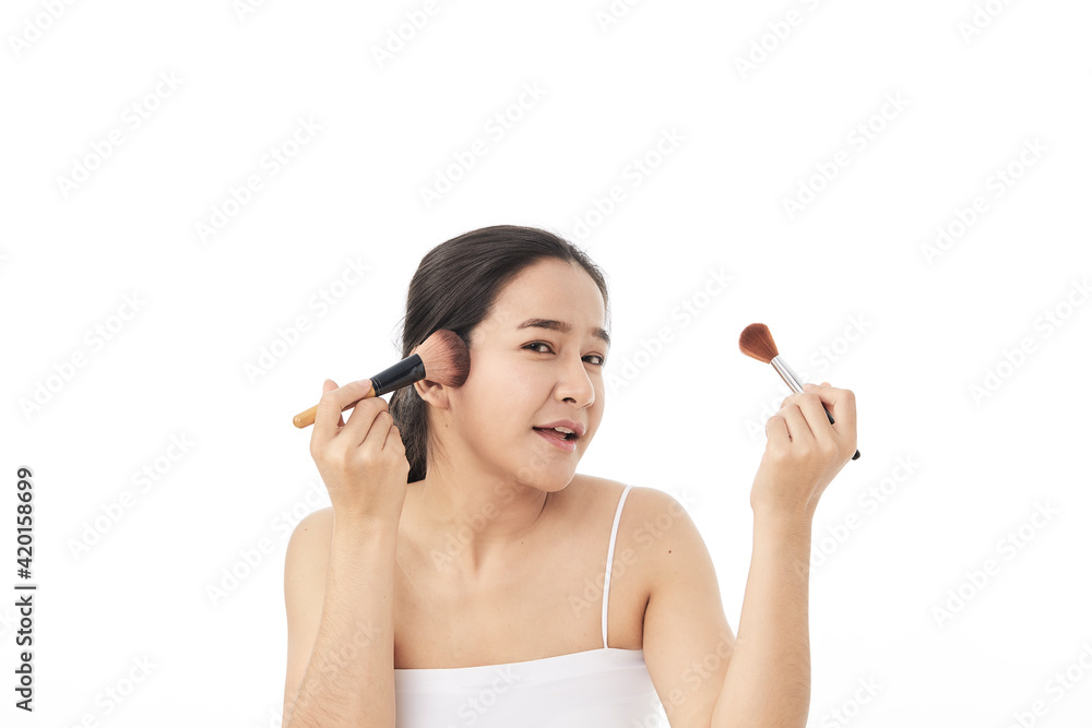 woman applying make up with a brush woman applying make up with a brush