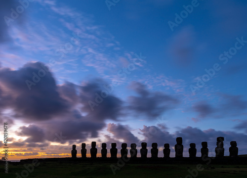 Silhouette of Moai statues at sunrise, Ahu Tongariki, Easter Island (Rapa Nui), Chile.
