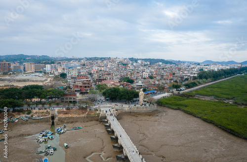 Aerial view of the sunset landscapes and city skyline at Luoyang Bridge, Quanzhou, China. Luoyang Bridge is the first stone bay bridge in China