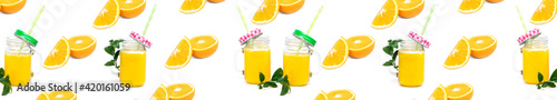 Banner Orange juice and green leaves isolated on a white background.A glass of orange juice. Healthy food. Vegan food