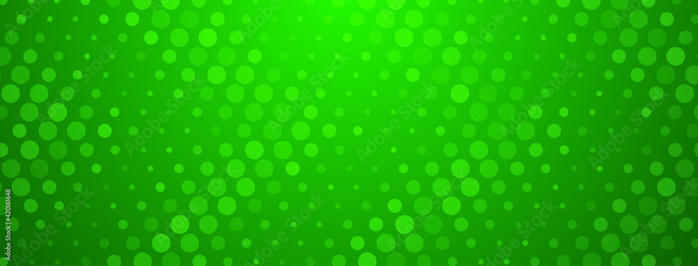 Abstract halftone background made of dots of different sizes in green colors Abstract halftone background made of dots of different sizes in green colors