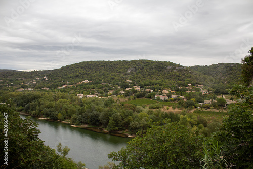 Ardeche river with village in background - France