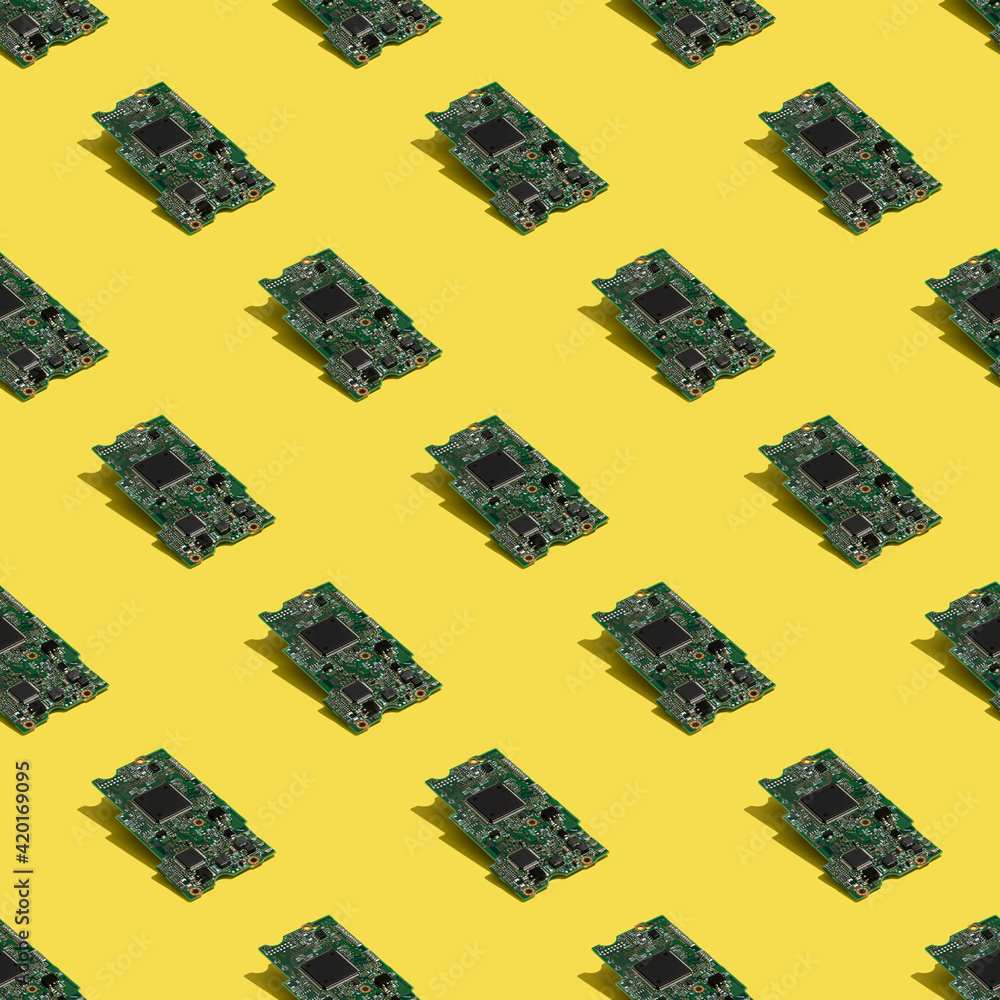 Fototapeta premium Motherboard of hardware data storage seamless pattern on yellow background. Computer technologies backdrop. 
