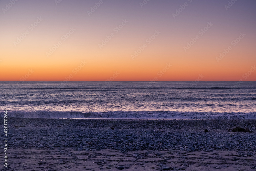 Fototapeta premium Ocean beach at sunset. South Island, New Zealand.