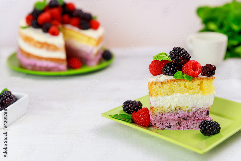 Piece of berry cake decorated with fresh raspberries and blackberries. Piece of berry cake decorated with fresh raspberries and blackberries.