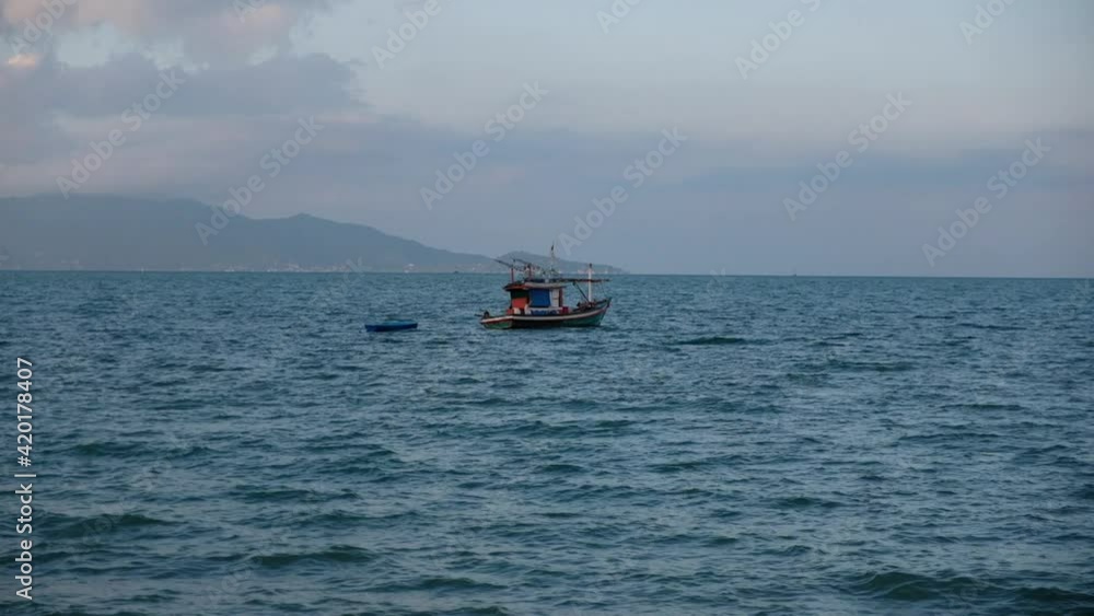 Slow motion of long tail boat sailing in the sea Slow motion of long tail boat sailing in the sea