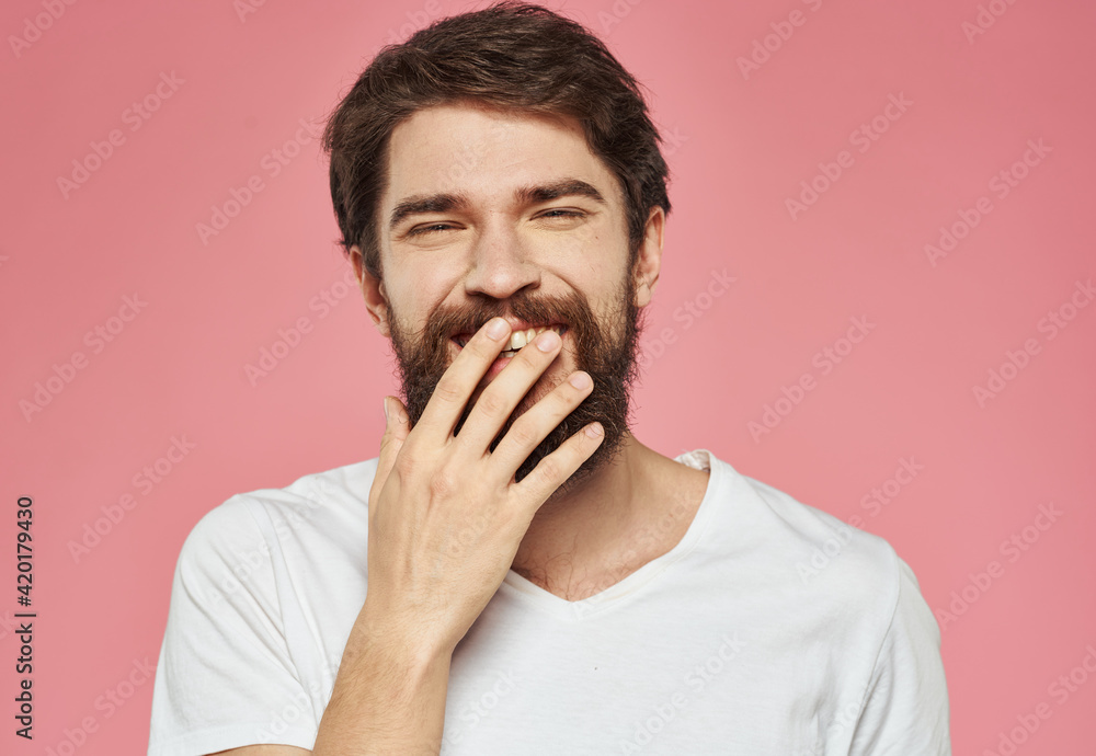 Portrait of happy man with bushy beard emotions model pink background