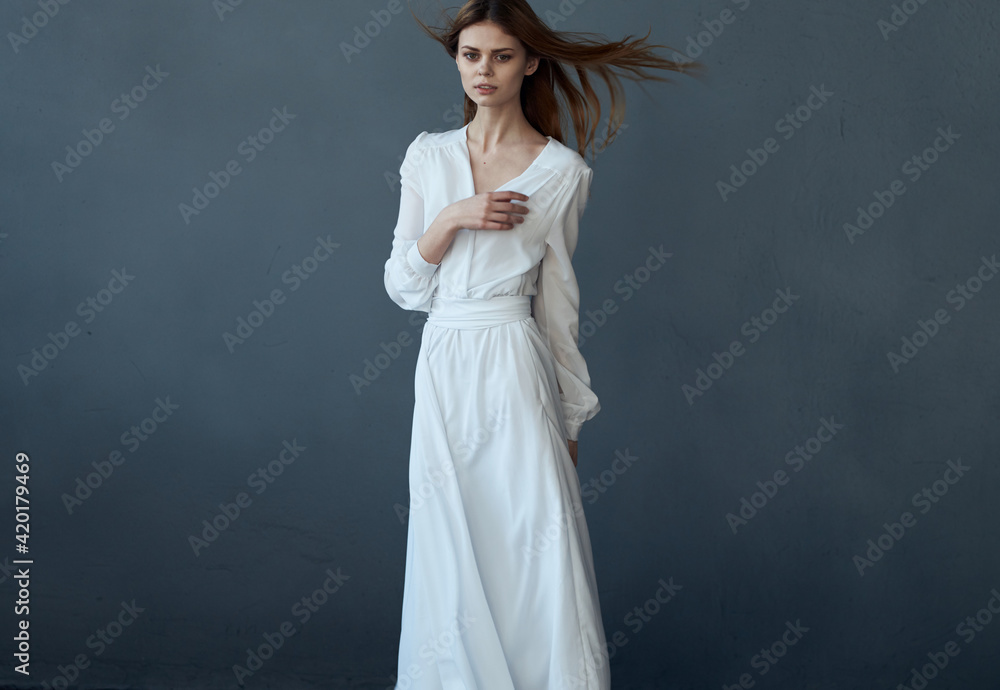 woman in white dress dance performance charm gray background woman in white dress dance performance charm gray background