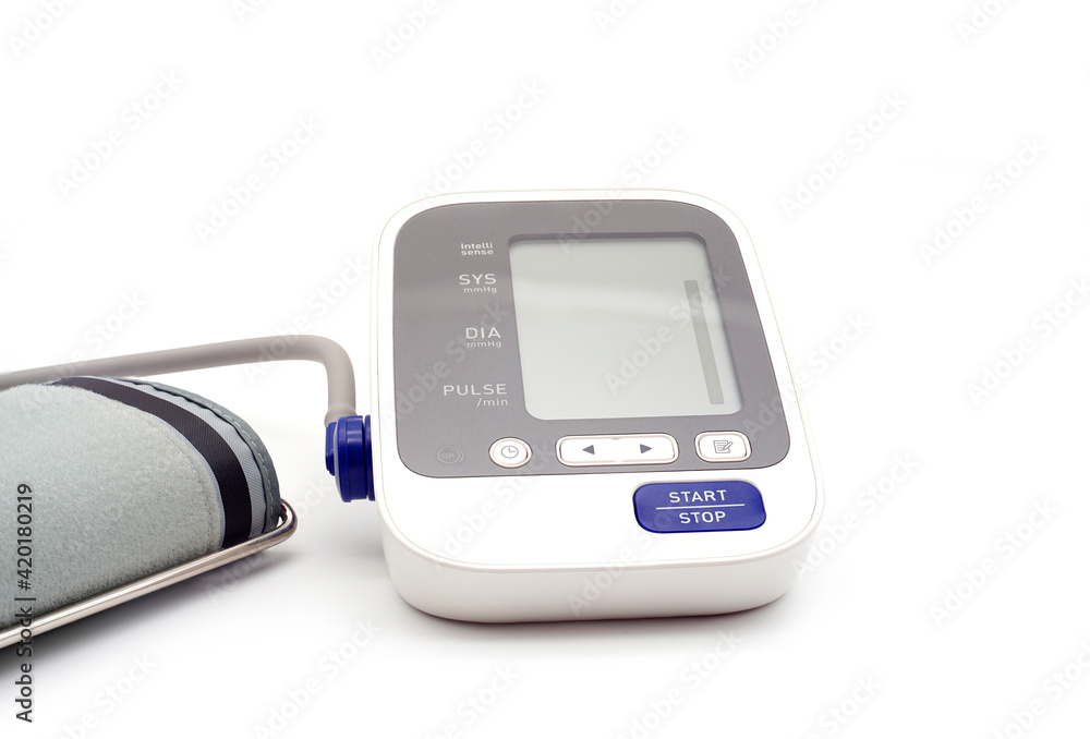 A white digital thermometer and digital sphygmomanometer A white digital thermometer and digital sphygmomanometer