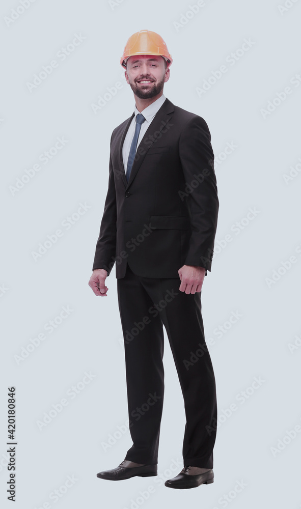 in full growth. successful businessman in a protective helmet in full growth. successful businessman in a protective helmet