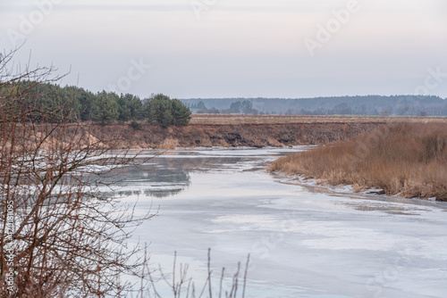 Fototapeta Naklejka Na Ścianę i Meble -  winding river that is still frozen