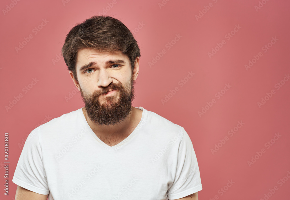 man grimacing on pink background cropped view Copy Space man grimacing on pink background cropped view Copy Space