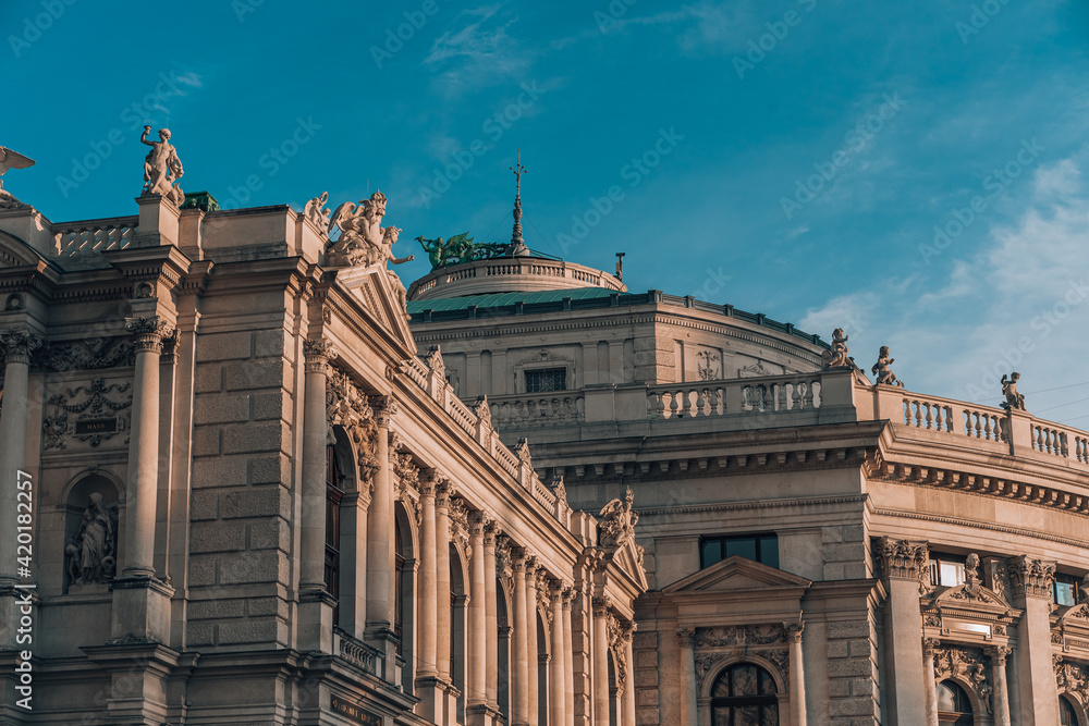 Facade of burgtheater in Vienna during golden hour sunset