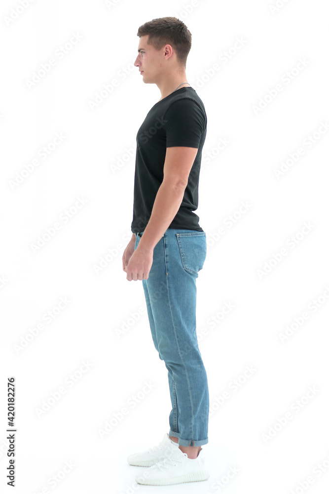 side view. confident guy in a black t-shirt . side view. confident guy in a black t-shirt .