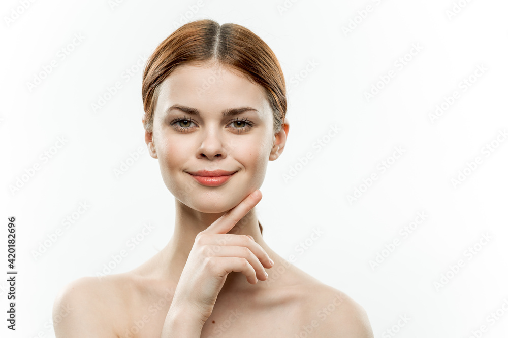 pretty woman naked shoulders cosmetics smile hands near face pretty woman naked shoulders cosmetics smile hands near face