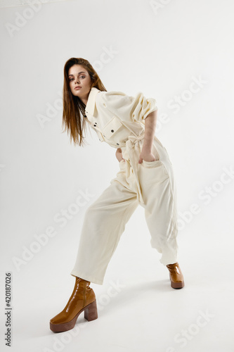 fashionable woman in suit stylish clothes posing studio
