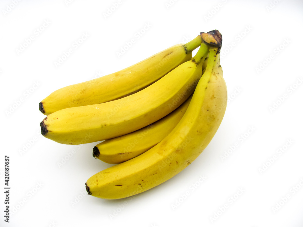 A bunch of yellow fresh ripe bananas on a white background