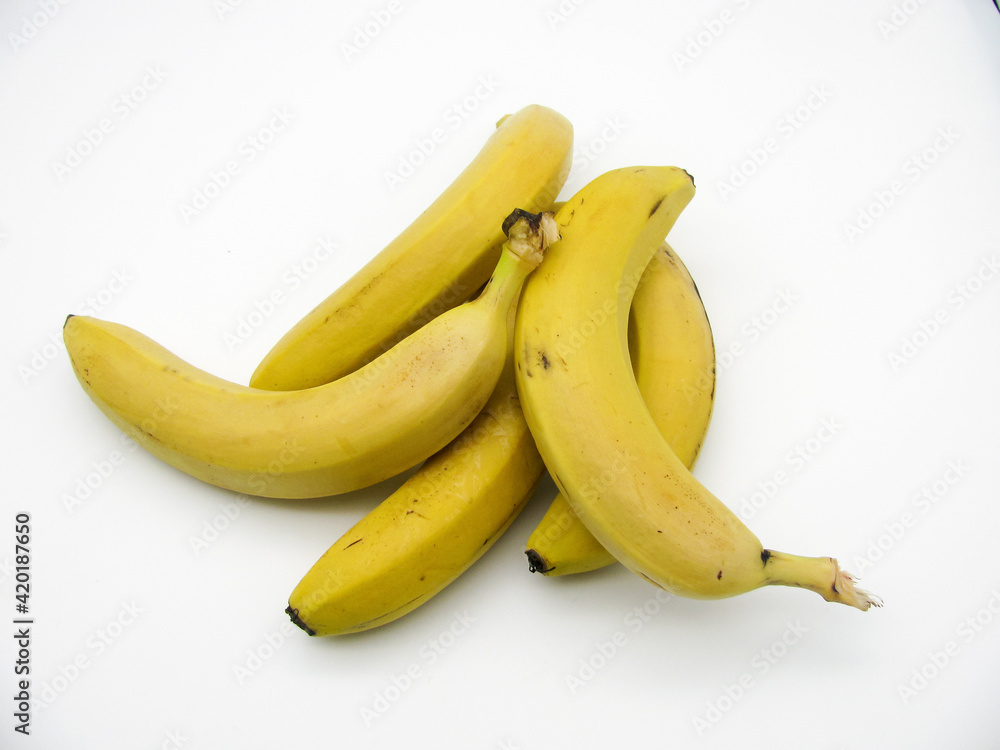 Five yellow fresh ripe bananas on a white background Five yellow fresh ripe bananas on a white background