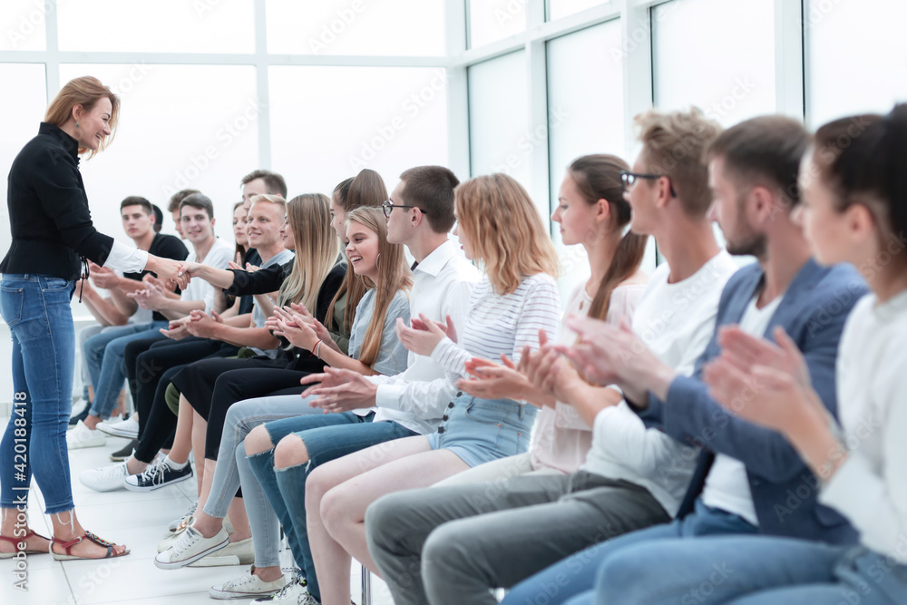 handshake of young people during business training. handshake of young people during business training.