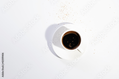 freshly brewed black natural coffee in a cup on a white background