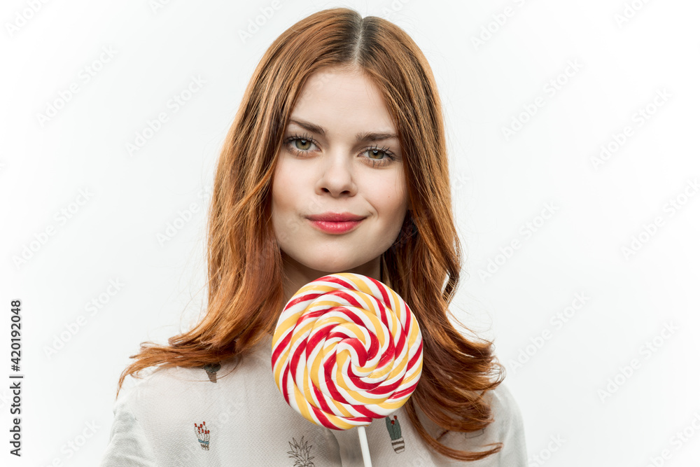 emotional red-haired woman holding lollipop sweets fun candy