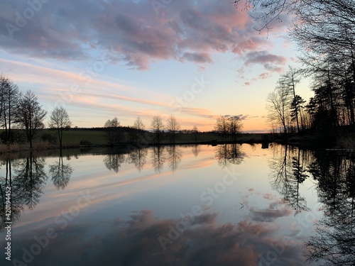 Water surface as a mirror of the sunset