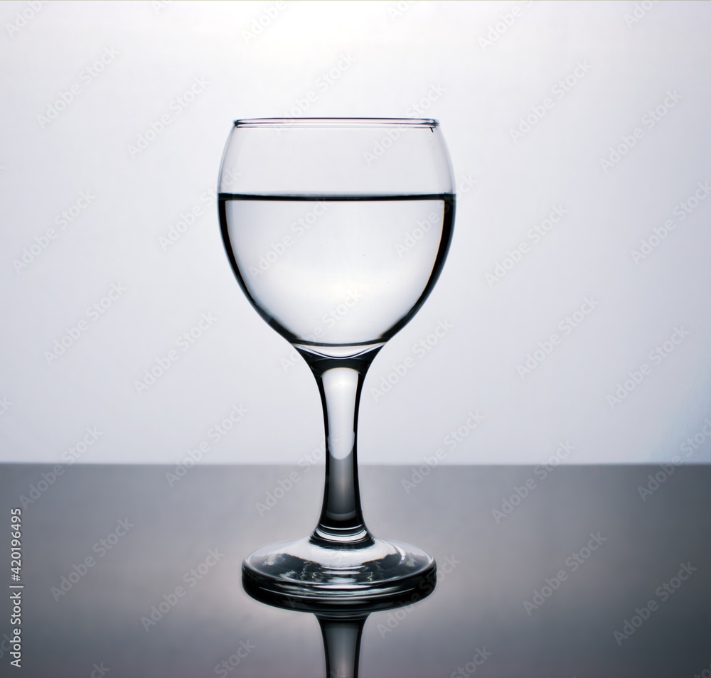 Glass of water isolated in black and white image for background ,glass of wine ,dinner ware Glass of water isolated in black and white image for background ,glass of wine ,dinner ware