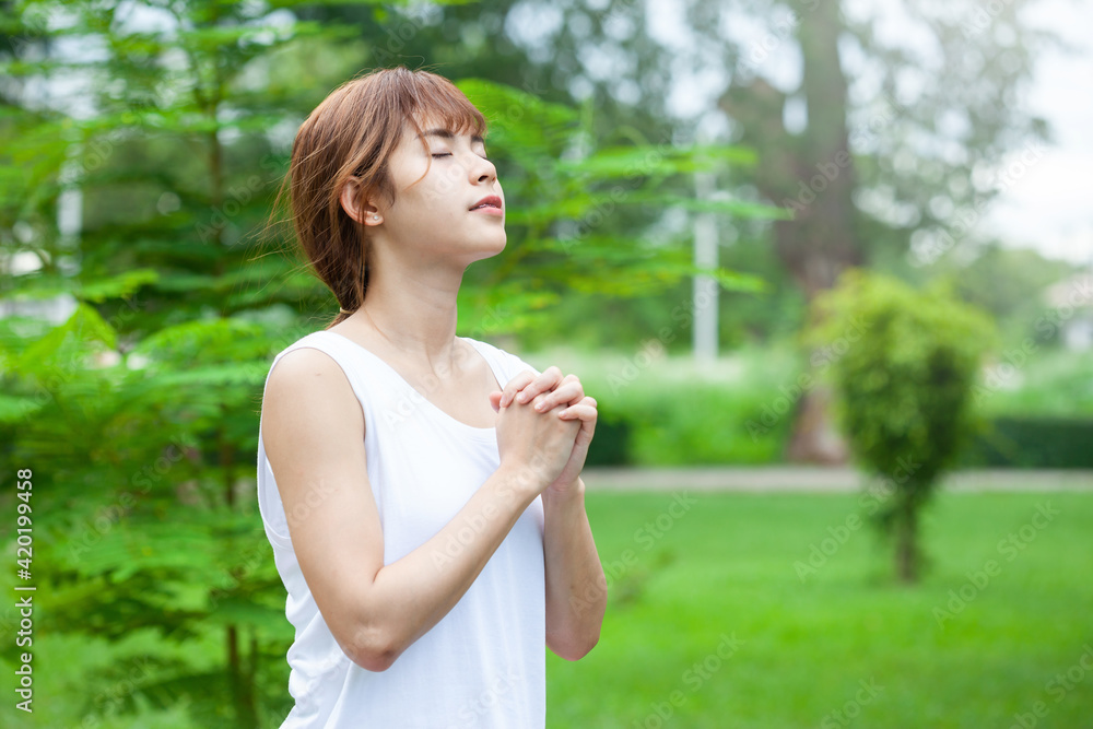 Asian woman practicing yoga breath exercise concept In public areas. Asian woman practicing yoga breath exercise concept In public areas.