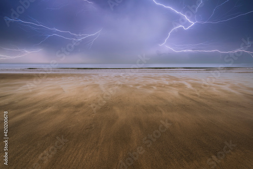 Footprints on beach Summer sunset landscape photo