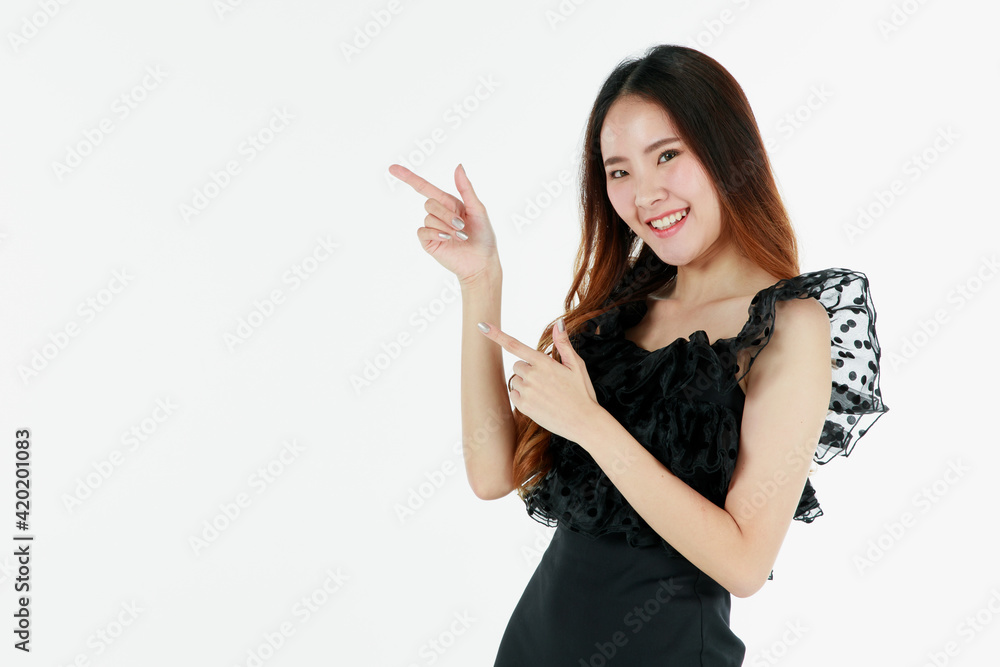 Portrait of young and cute self-confidence brunette long hair Asian girl with smile and friendly face. Charming girl pose with happy studio shot isolated on white background with finger pointing Portrait of young and cute self-confidence brunette long hair Asian girl with smile and friendly face. Charming girl pose with happy studio shot isolated on white background with finger pointing