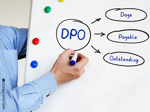 Conceptual photo about DPO Days Payable Outstanding . Simple on white board with marker pen photo